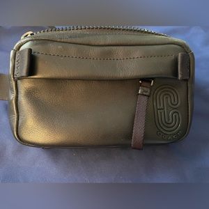 Coach Fannypack. Only used one time. I can’t get used to wearing it.
